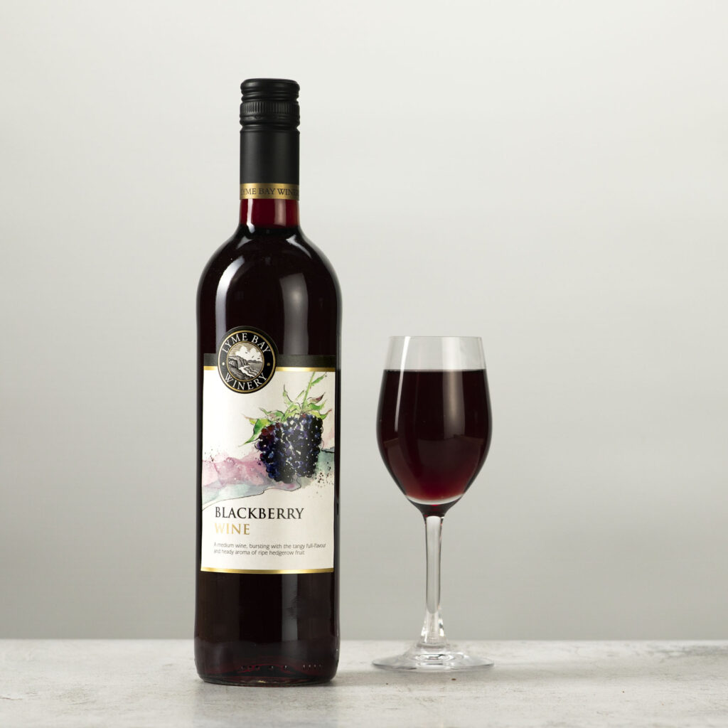 Blackberry wine with glass