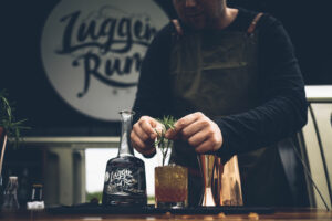 barteder creates a cocktail with lyme bay's lugger rum