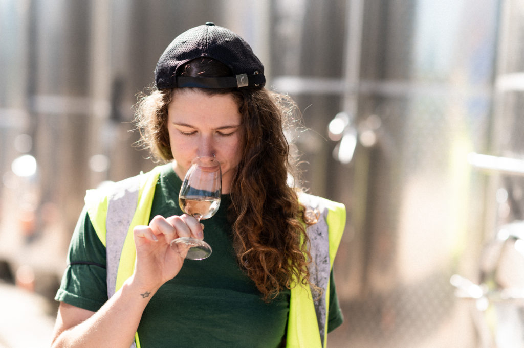 lyme bay winery winemaker smelling a glass of wine