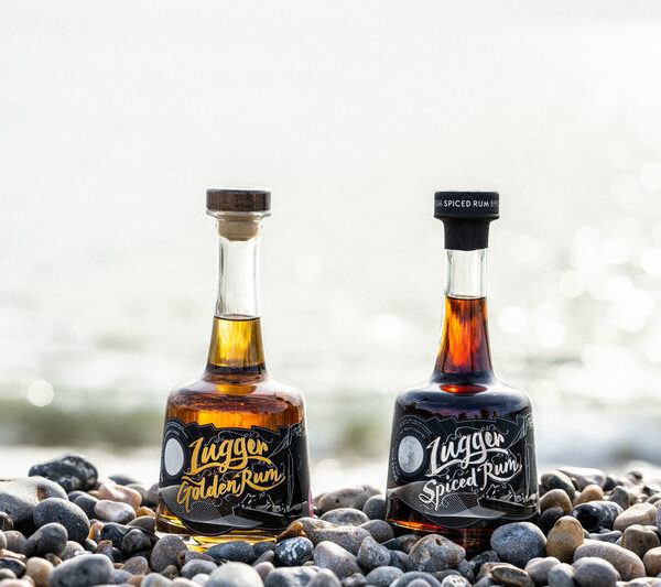 Lugger Rum and Golden Lugger on a pebble beach